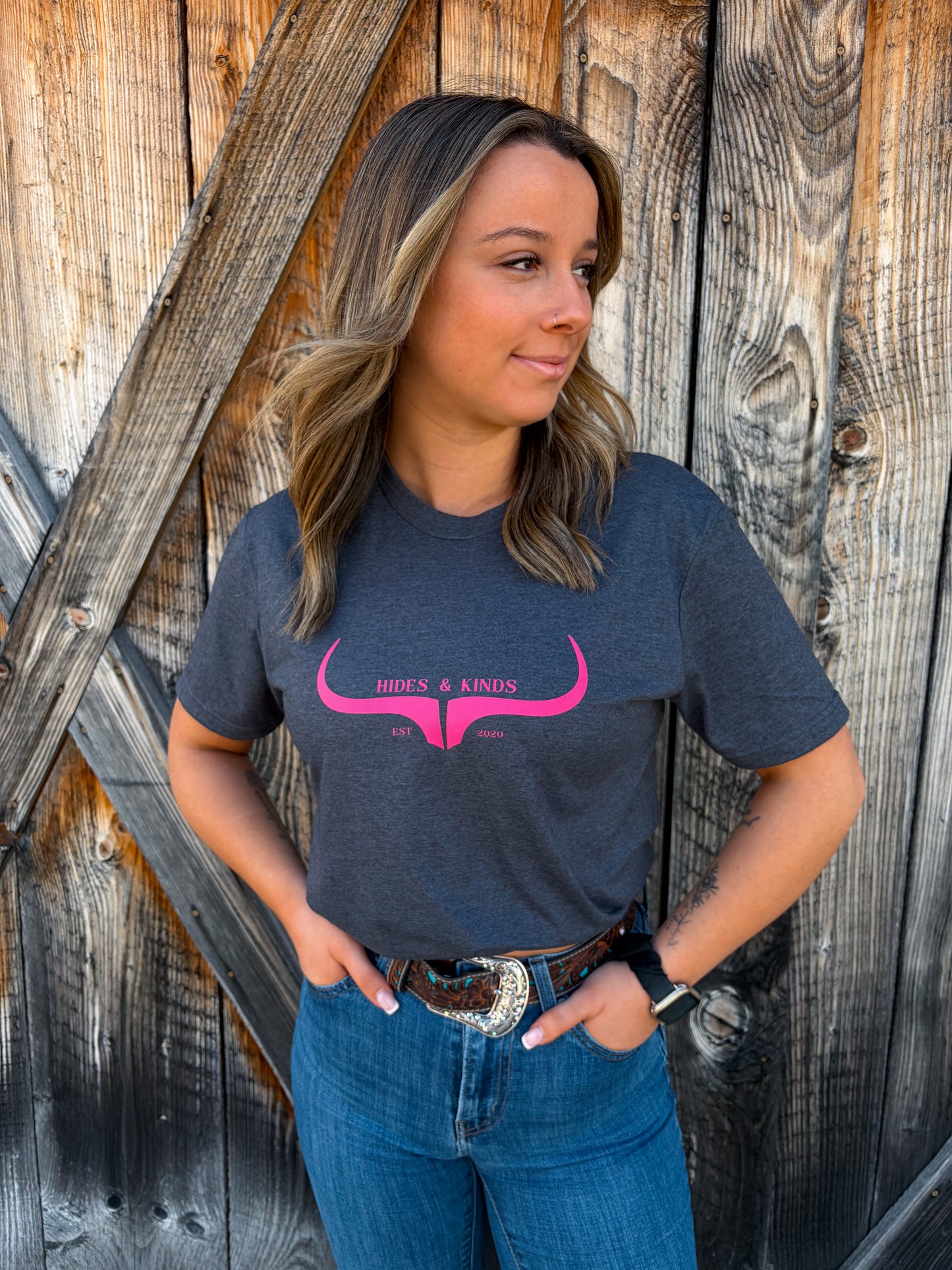 Full view of dark grey Hides and Kinds t-shirt with pink longhorn design