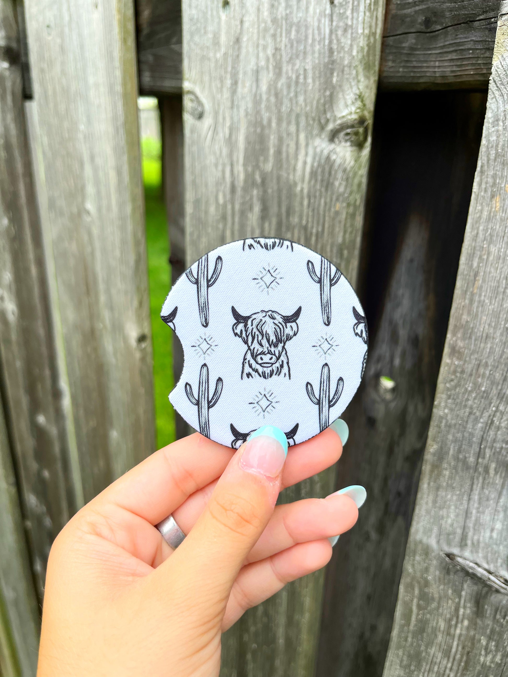Western Highland cow print car coasters on light background – Hides & Kinds