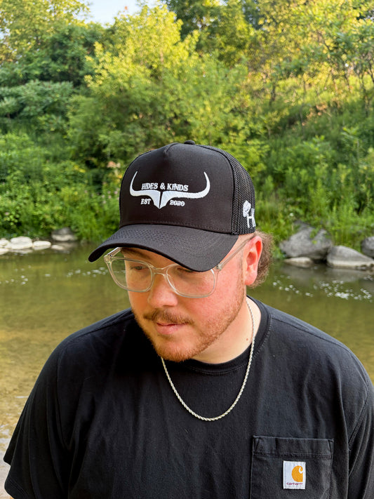 Hides & Kinds Original Logo black meshback trucker hat with white longhorn embroidery