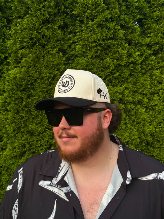 Man wearing The Outrider Hat showing front logo and side HK branding