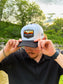 Hides & Kinds Southwest Snapback featuring a white crown, black brim and embroidered desert patch