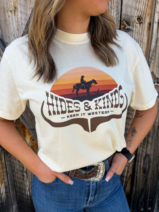 Hides and Kinds Sundown Rider Tee in ivory with western sunset graphic and horseback rider design close up