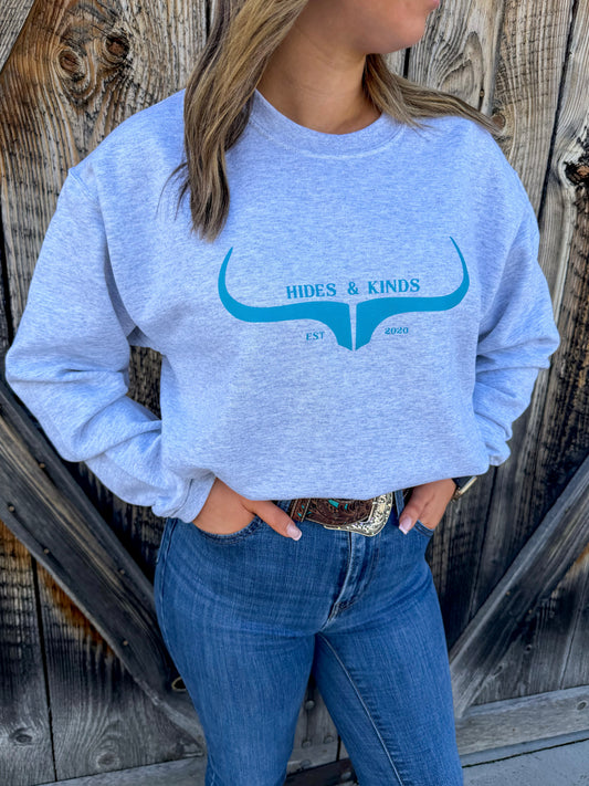 Ash grey crewneck sweatshirt with teal longhorn logo by Hides and Kinds