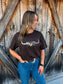 Close up of camo longhorn logo on brown Hides and Kinds western t-shirt