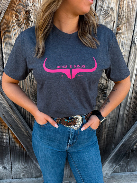 Country outfit featuring grey graphic tee with pink logo and denim jeans
