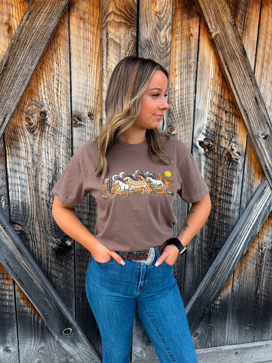 Model wearing espresso Wild Run Tee by Hides and Kinds styled with denim and western belt