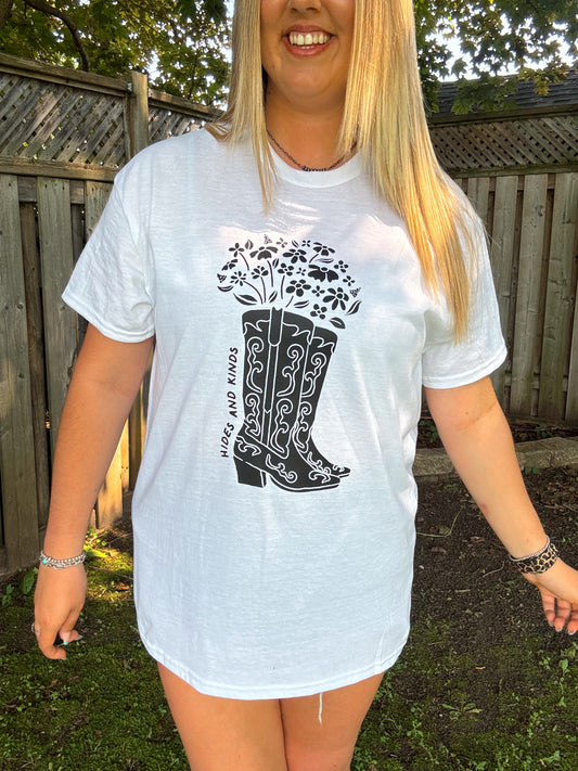 Close up of HK Floral Cowboy Boots tee by Hides and Kinds with black western boot and floral design on a white shirt.
