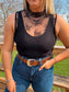 Black lace mesh tank top paired with jeans and tooled leather belt