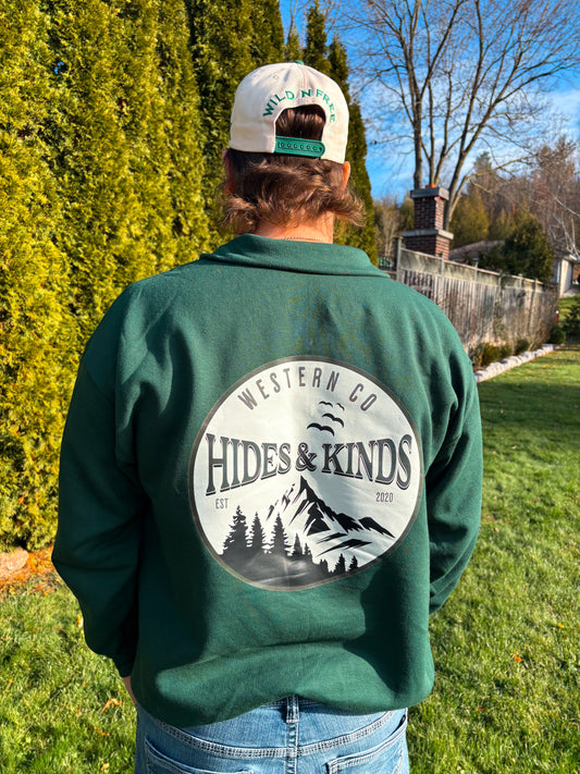 Back view of forest green High Country quarter zip featuring large Hides & Kinds mountain graphic