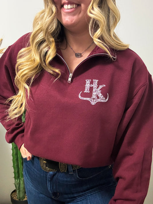 Mid view of maroon HK quarter zip pullover showing off signature western design and cozy fit.