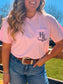 Zoomed in view of the Hides and Kinds Blossom Pink tee with intricate HK logo on chest pocket.