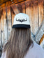 Back view of the Hides & Kinds original logo hat in black and natural, showing embroidered western longhorn logo and structured fit.