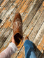 Brown Bronco Booties styled with jeans on wooden deck