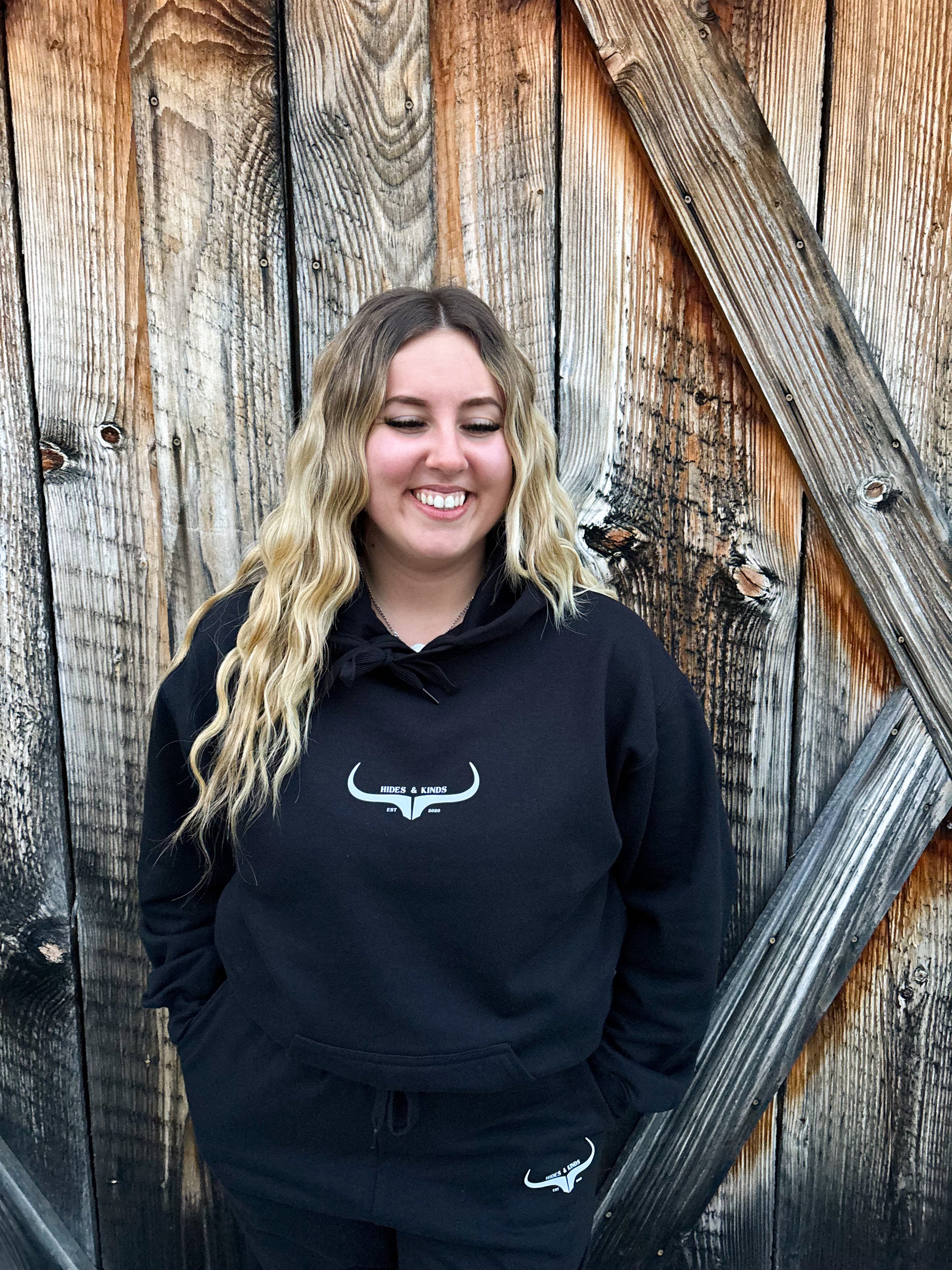 Front view of the black hoodie from the Original Logo Matching Set showing the HK longhorn chest logo.