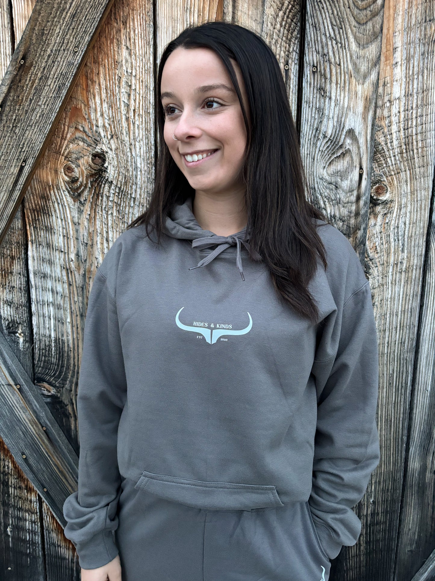Close-up of the charcoal grey hoodie from the Original Logo Matching Set featuring the HK longhorn chest logo.