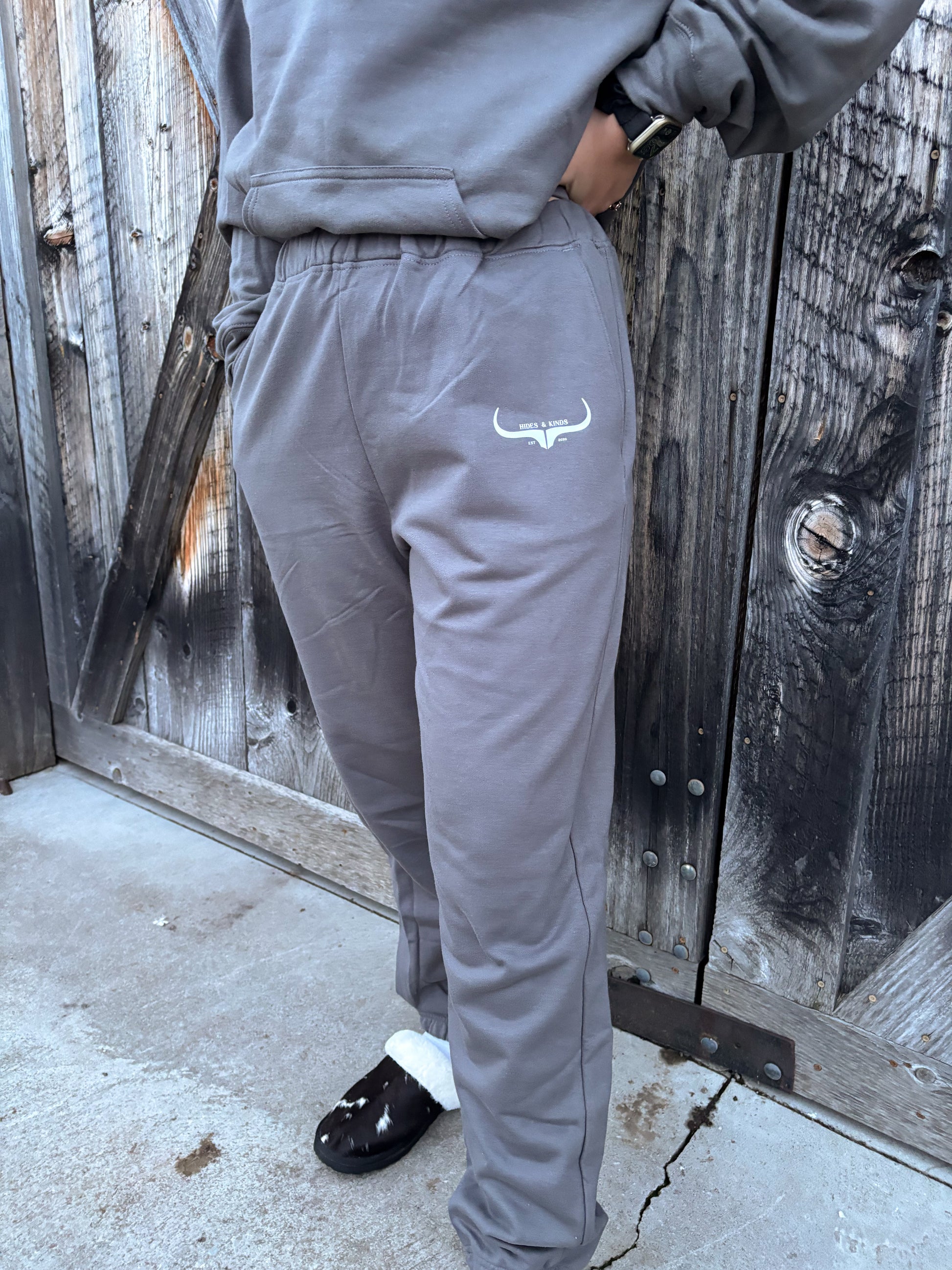 Close up of the charcoal grey joggers from the Original Logo Matching Set with the HK longhorn logo.