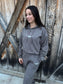 Front view of the Original Logo Matching Set in charcoal grey featuring the HK longhorn logo on the hoodie and joggers.
