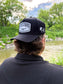 Rear view of the Hides & Kinds Outlaw Hat showing the structured snapback fit.