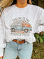 Woman wearing a grey crewneck sweatshirt with a vintage teal truck and pumpkins, reads "Take Me to the Pumpkin Patch" – cozy fall style by Hides & Kinds