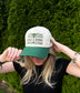Woman wearing The Ranchline Hat facing forward, showing full Hides & Kinds front design.