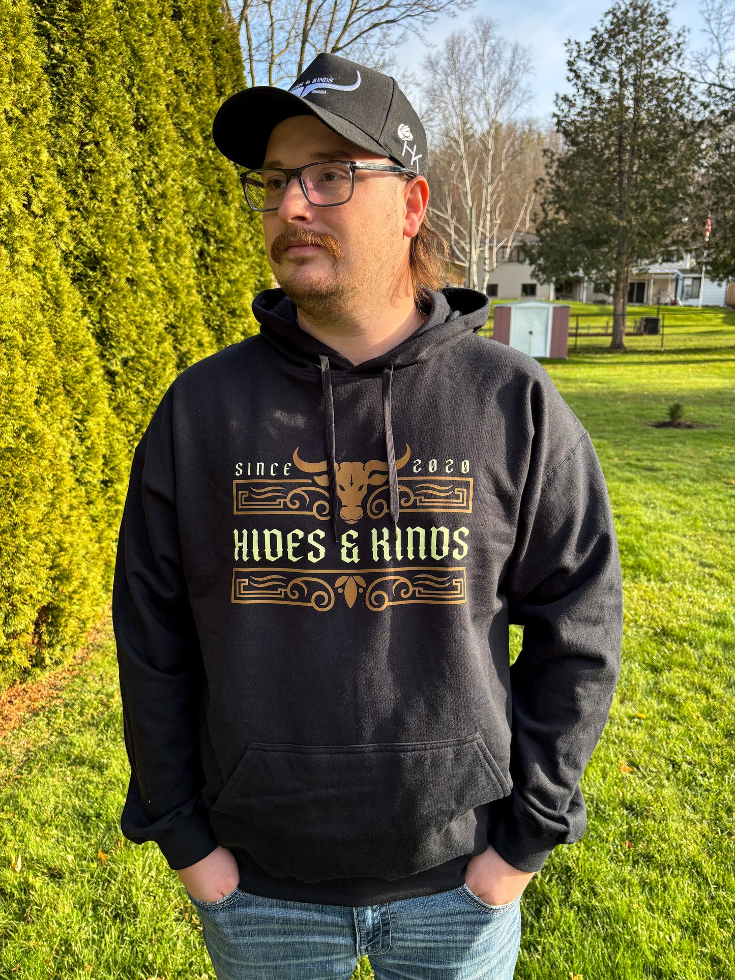 Men’s black Ranchline hoodie with Hides & Kinds since 2020 western logo graphic