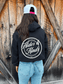 Back view of the Signature Western Hoodie in black featuring the large HK Western script graphic.