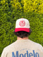 Man wearing The Stampede Snapback backwards, showing the bold embroidered Hides & Kinds logo on the back panel.