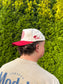 Side view of The Stampede Snapback hat showcasing HK initials and cowboy hat embroidery.