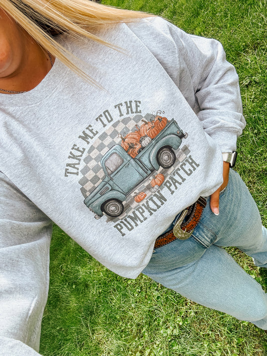Flat lay view of a grey pumpkin patch crewneck featuring fall truck and checkered print – Hides & Kinds fall western sweatshirt.