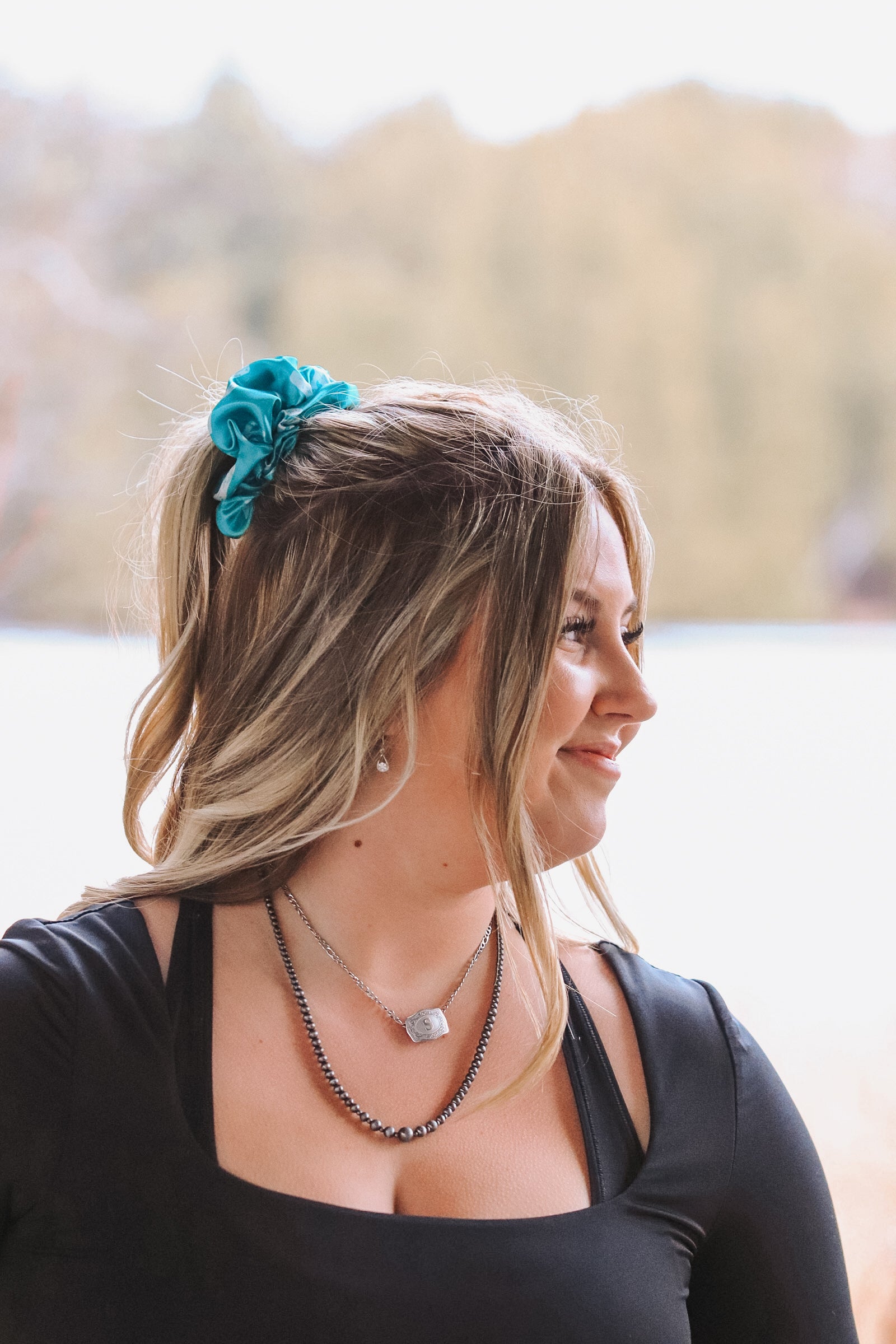 Teal cactus scrunchie styled in blonde hair – country chic look