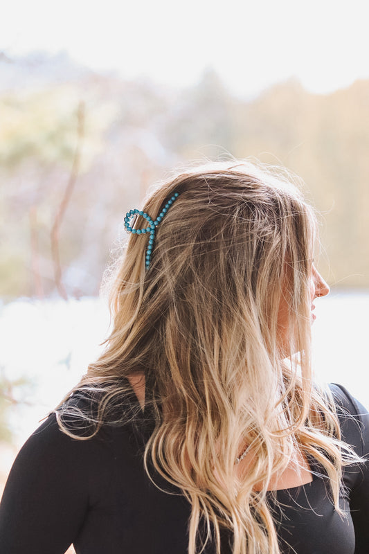 Turquoise beaded claw clip styled in western cowgirl hair accessory look