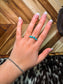 Close-up of turquoise teardrop cluster ring in sterling silver