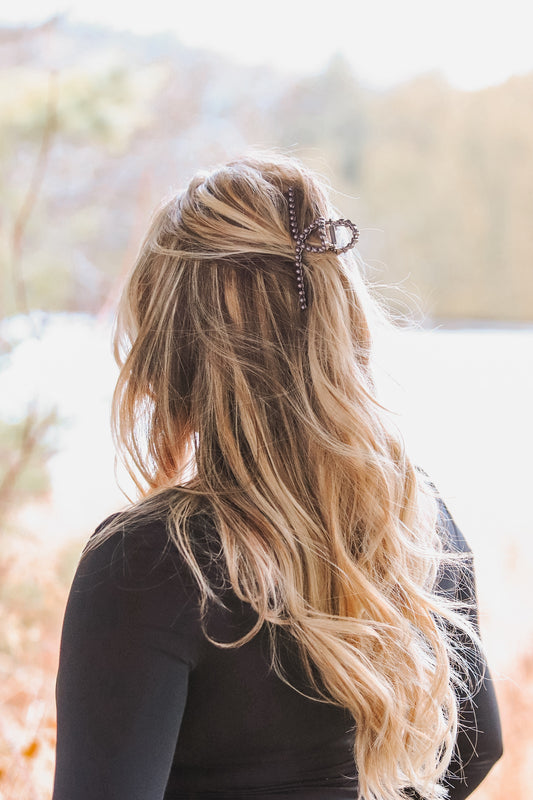 Back view of hair styled with pearl claw clip featuring western buckle design – Hides & Kinds