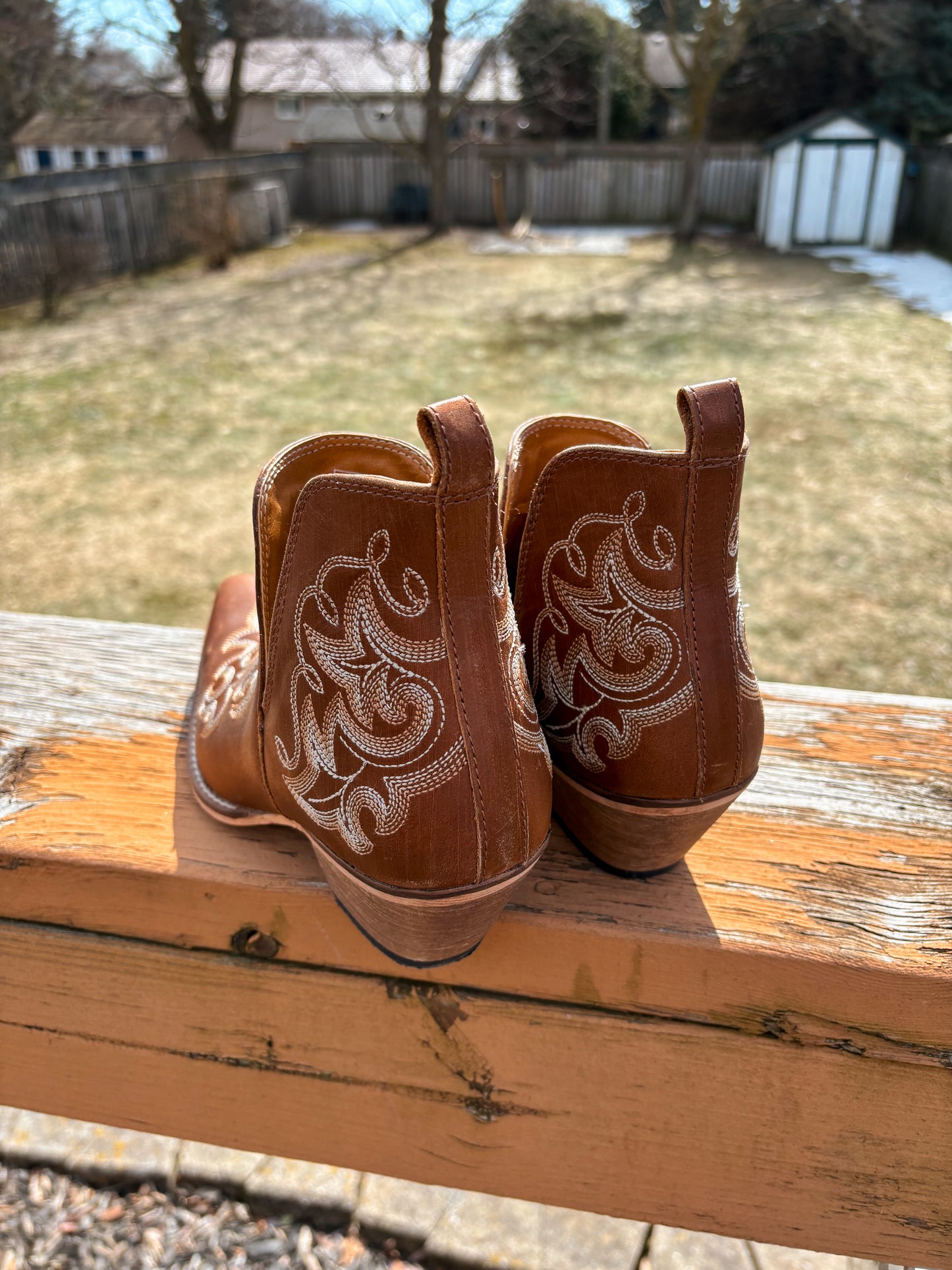 Back view of embroidered Brown Bronco Booties with stacked heel