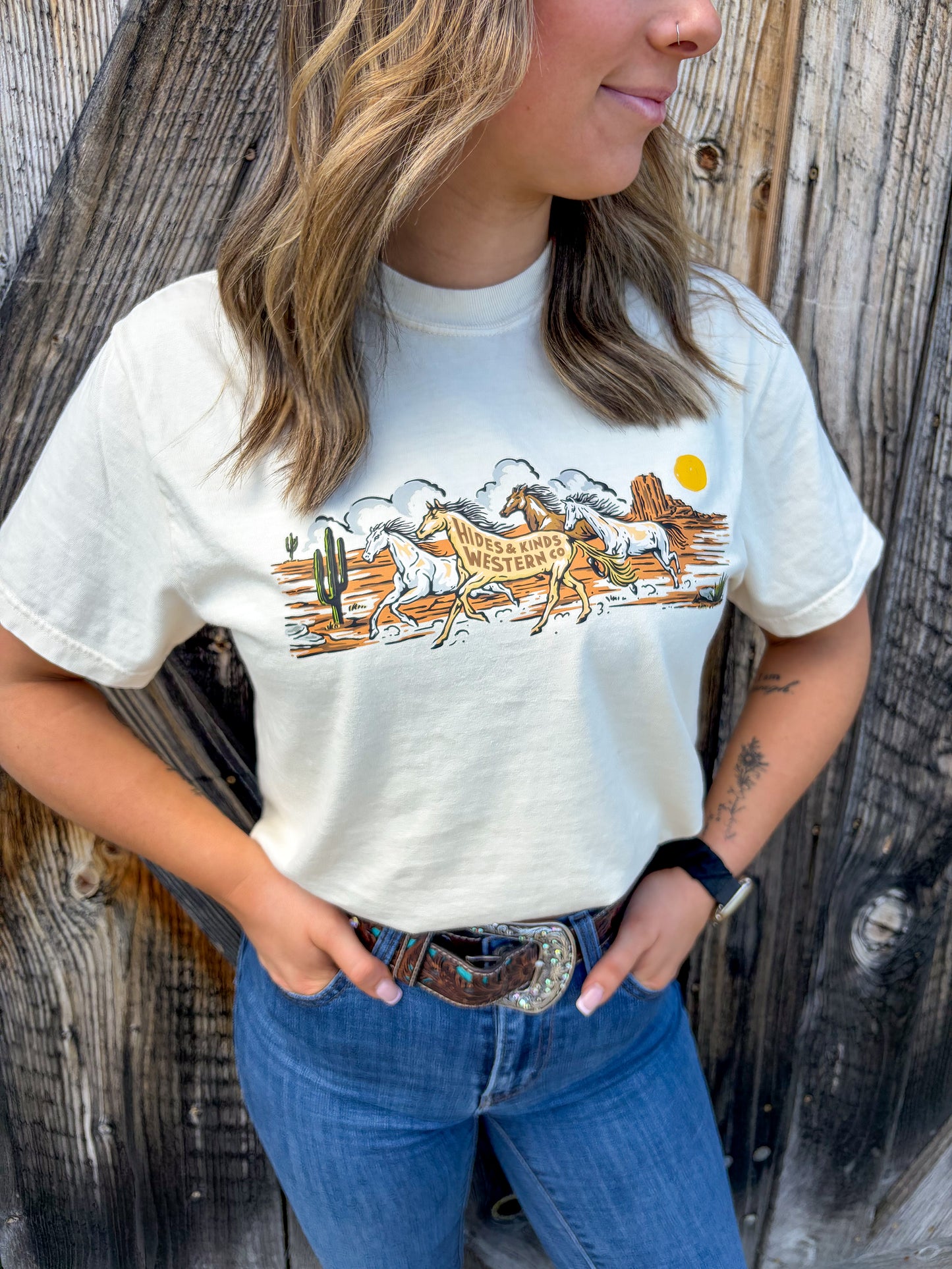 Close up of running horses western graphic on cream Wild Run Tee by Hides & Kinds
